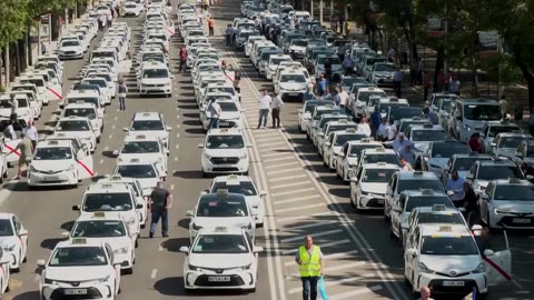 Madrid taxi drivers hold go-slow protest against ride-hailing vehicles