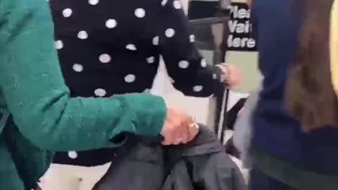 Incredible. An infant months old is escorted through TSA is this woman her mother?
