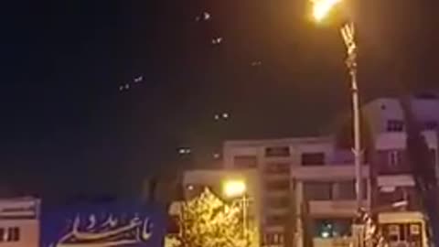 Iranians gather in "Revolution Square" to watch the interceptors try to thwart the
