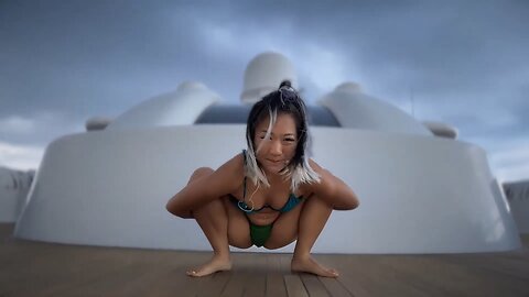 Asian Woman Rocky Ocean Greens Liberated Flow with Hani (Certified Yoga Pure Love Coach) 