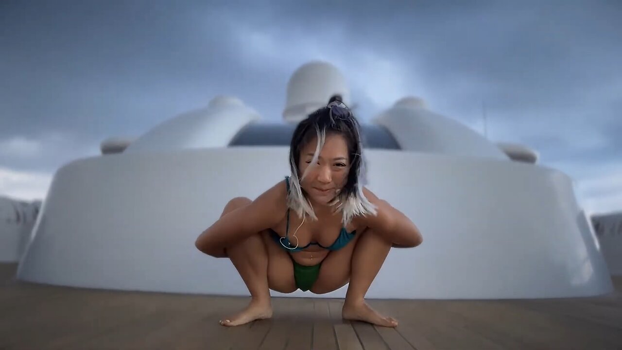 Asian Woman Rocky Ocean Greens Liberated Flow with Hani (Certified Yoga Pure Love Coach)