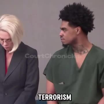 Man starring at his own lawyer for losing his case and receiving a lifetime sentence