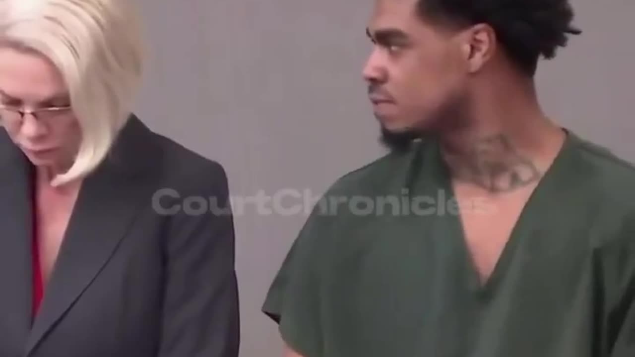 Man starring at his own lawyer for losing his case and receiving a lifetime sentence