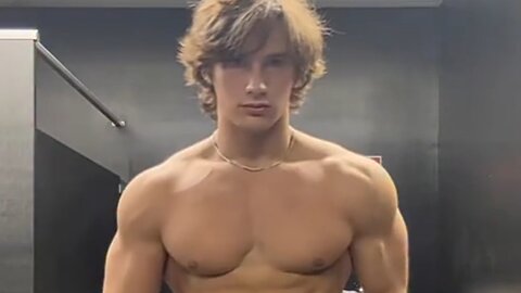 Handsome muscular man showing off his muscles