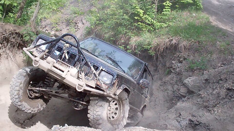 Jeep Cherokee XJ climbing rugged off road trail