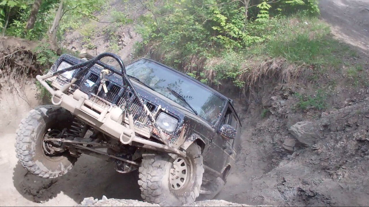 Jeep Cherokee XJ climbing rugged off road trail