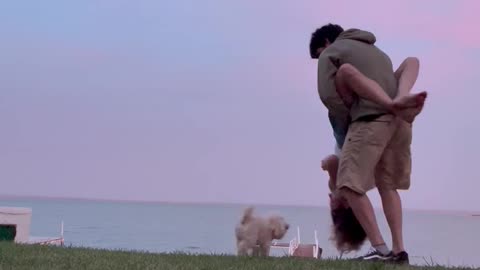 Dog Intrudes on Romantic Moment