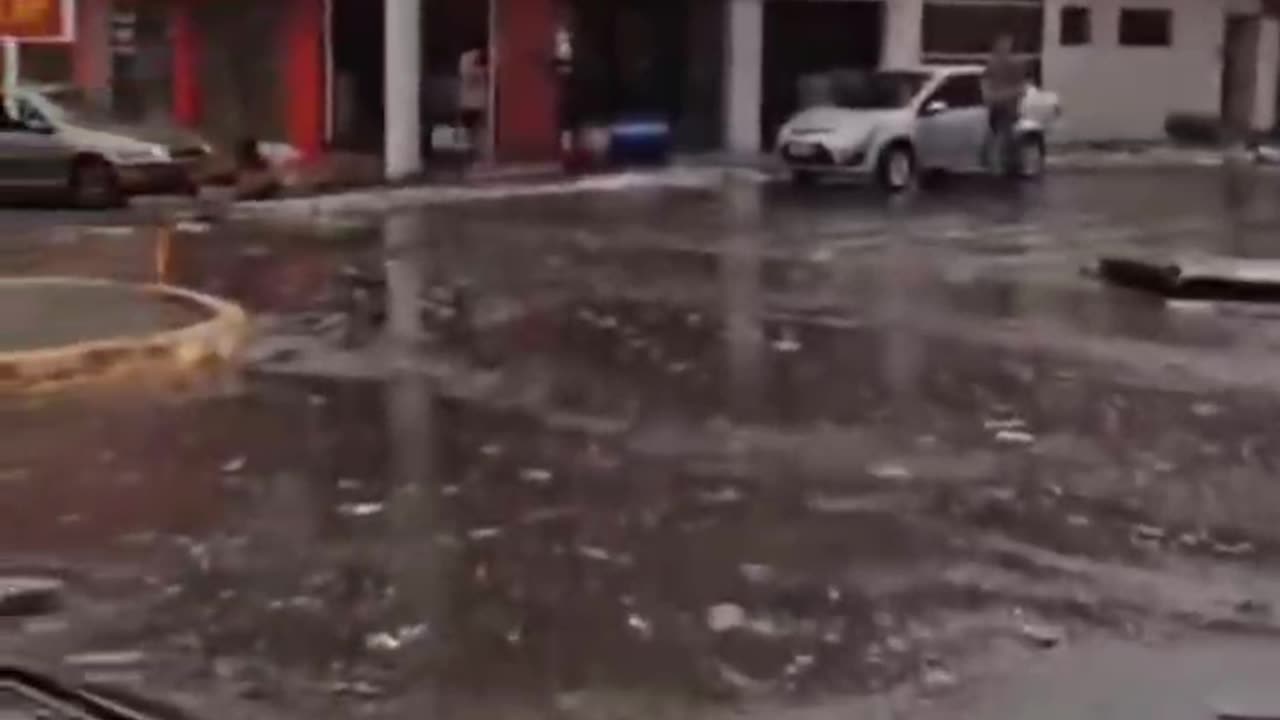 Man walks through the destruction of a tornado in Brazil