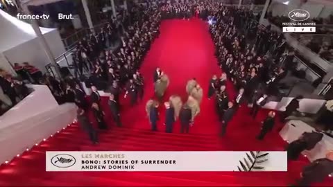Sean Penn and Bono walk the Cannes Red Carpet with Ukranian soldiers.