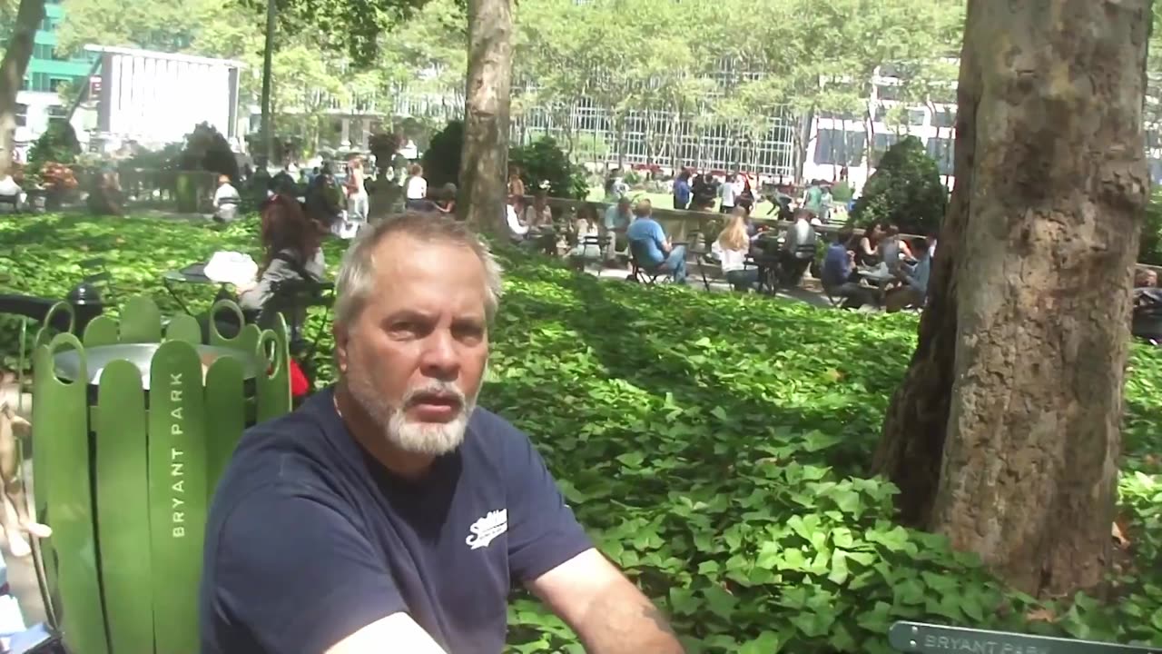 Luodong Massages Elderly White Man's Shoulders and Back At The Town Square