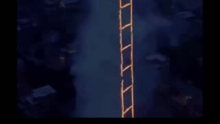 man lights fire to a ladder in the sky
