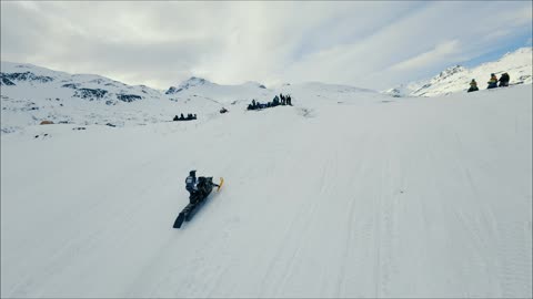 Competitor Crashes At Snowmachine Hill Climb