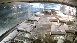 Storm surge floods dining room of Italian seafront restaurant