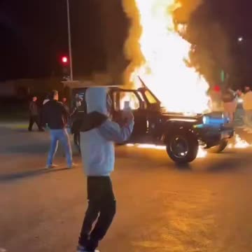 Rioters in LA are pouring gasoline on vehicles and setting them on fire