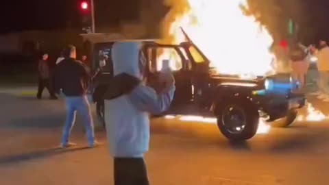 Rioters in LA are pouring gasoline on vehicles and setting them on fire