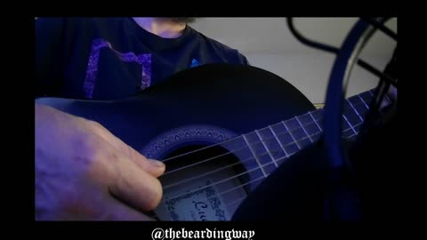 Playing a guitar. I got a tune in my head and I can't play it right yet.