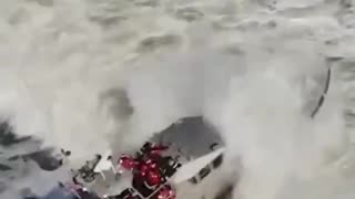 US Coast Guard training in rough surf.