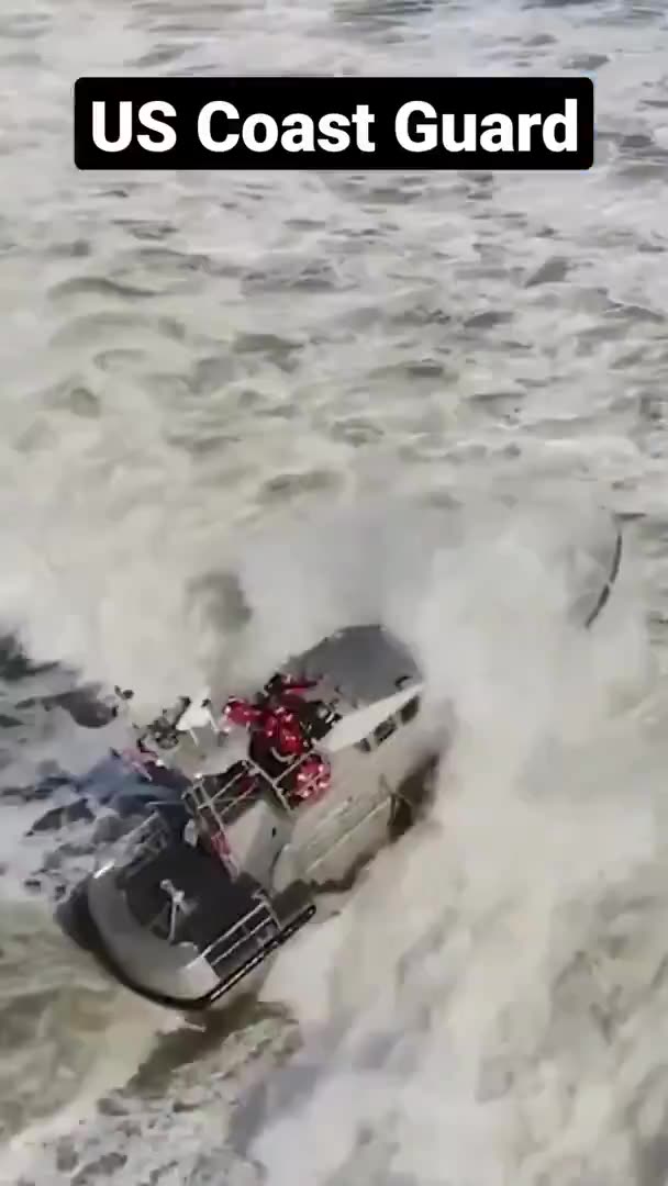 US Coast Guard training in rough surf.