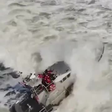 US Coast Guard training in rough surf.