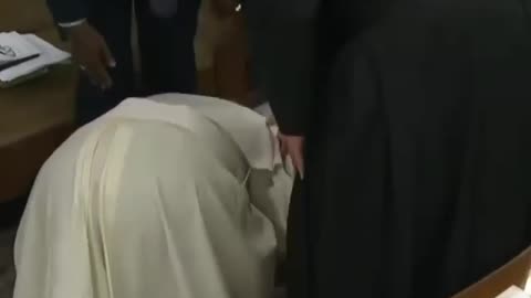 THE POPE KISSING THE FEET OF THE MOORS