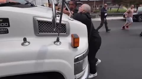Fat Anti-ICE protester tries to stop immigrant bus leaving Newark, NJ facility
