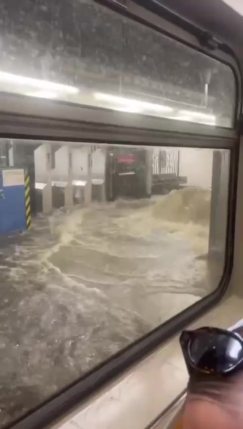 🌊 WILD! Severe flooding leaves commuters stranded as water pours into New York City subway stations.