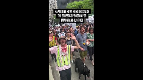 Activists opposing ICE policy march through Boston, showing support for undocumented migrants.