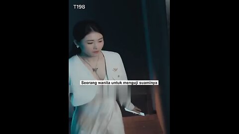 A wife hides behind glass to test her husband's loyalty