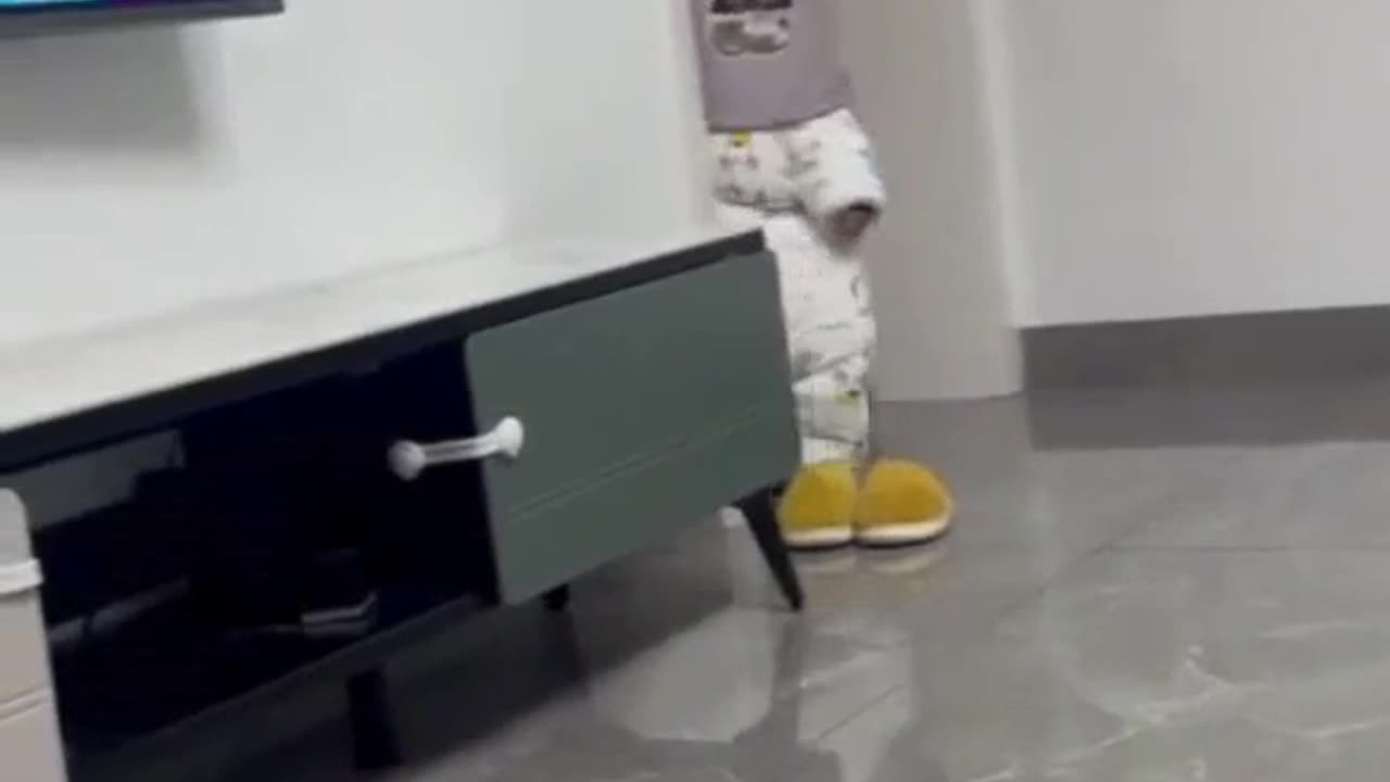 Kid puts bucket on his head and bumps around the house! 😂🪣 #KidAdventures