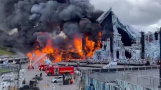 Large fire engulfs main stage at Tomorrowland music festival in Belgium, set to start Friday.