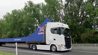 German motocross star lands Tsunami backflip between moving trucks