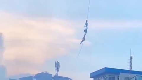 Nepal's MP ministers escaped by hanging from a helicopter rope.
