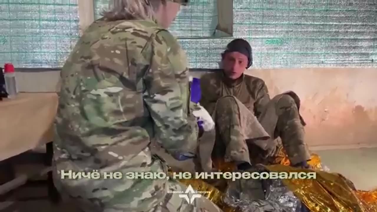 Medics Examine 17-Year-Old Russian Soldier Who Surrendered After Being Shelled by His Own Side
