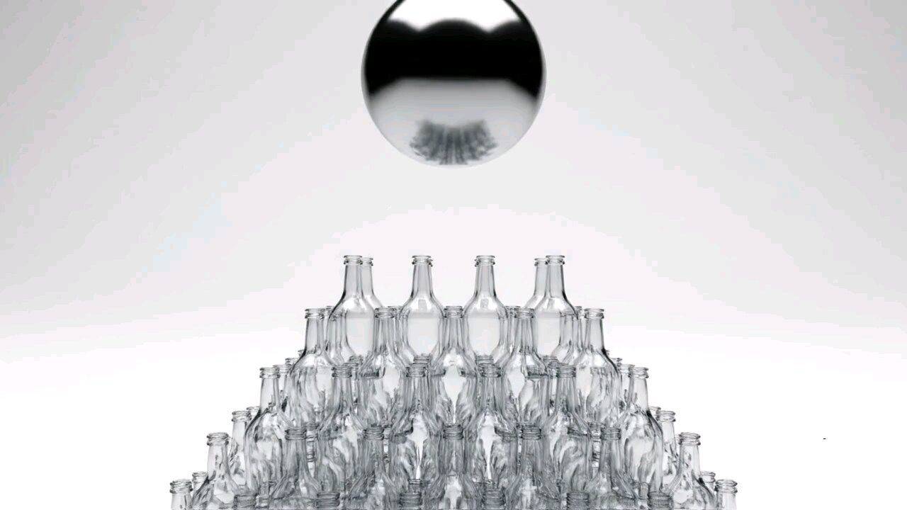 A metal ball was thrown into a pile of glass bottles.