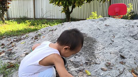 My little engineer at work; truck, sand, and endless joy 🌟