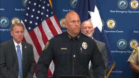 Assassin was dressed as a policeman & had a vehicle that looked like a cop car