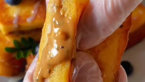 Peanut butter cream and strawberry blueberry toast in small bite