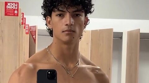 Handsome muscular man showing off his muscles