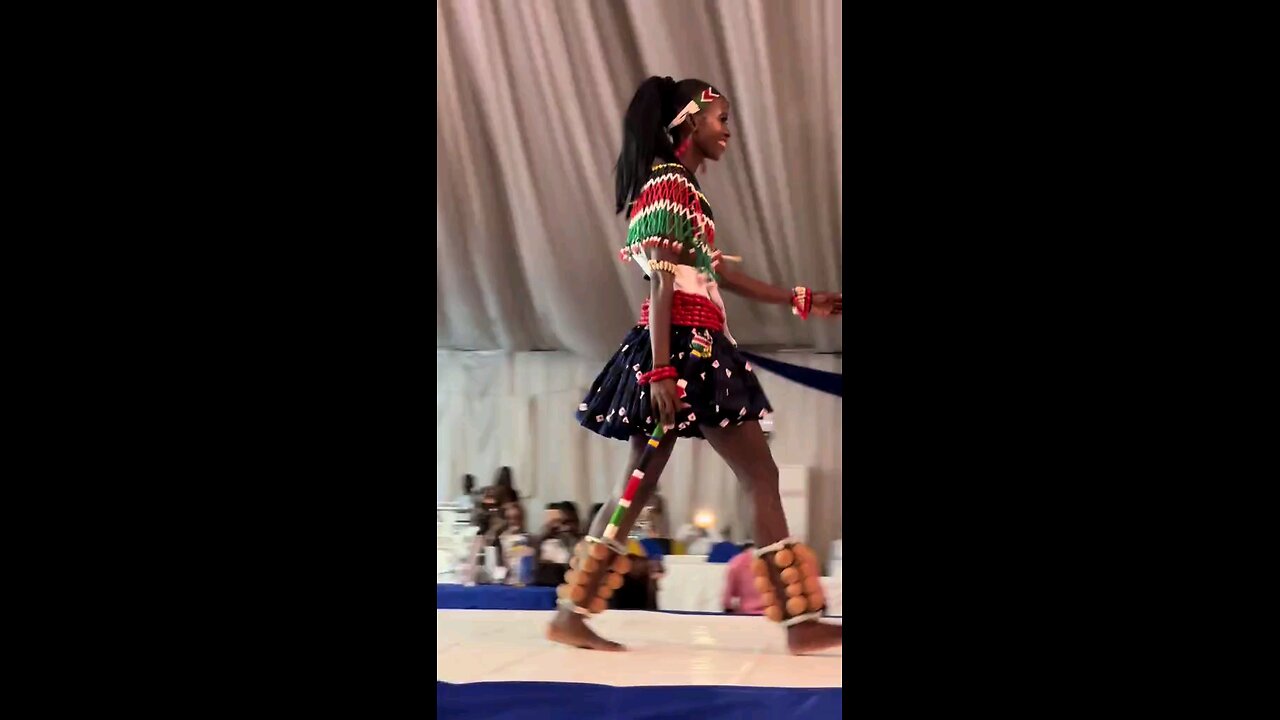 A BEAUTIFUL LADY SHOWCASING HER DANCING SKILLS FROM SOUTH SUDAN