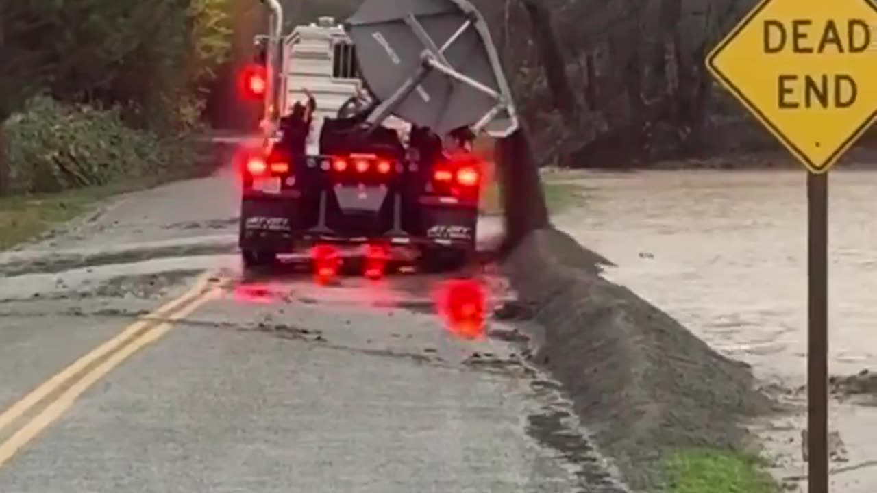 A truck in Whatcom County dumped large amounts of sand to help divert rising floodwaters