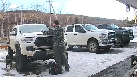 Squirrel Jumps Out From Underneath Truck Hood