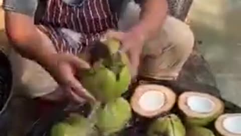 Processing Young Coconuts By Hand with Help From Machines