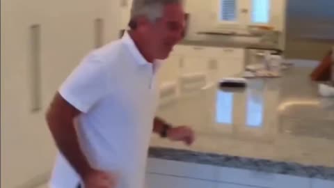 Bizarre Video of Epstein Chasing Girls Around His Kitchen