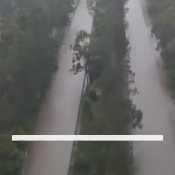 Pacific Highway turned into a river as flooding hits the Mid North Coast of NSW