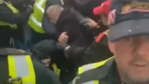The British police try to stop march in London but fail and are overwhelmed by patriots.