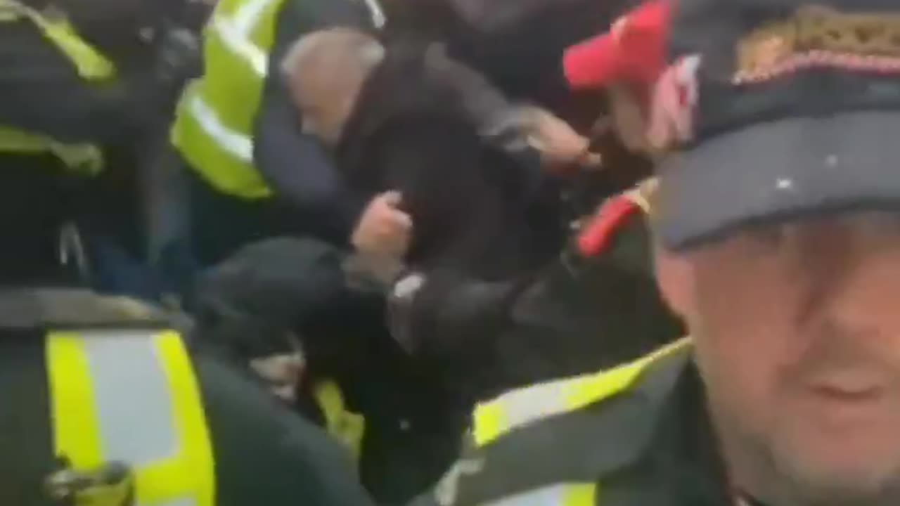 The British police try to stop march in London but fail and are overwhelmed by patriots.