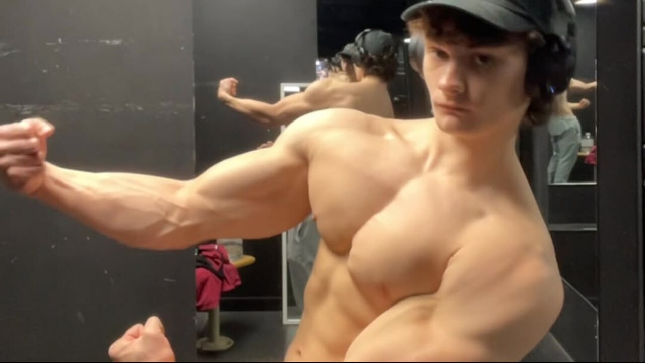 Handsome aesthetic bodybuilder showing off his muscles