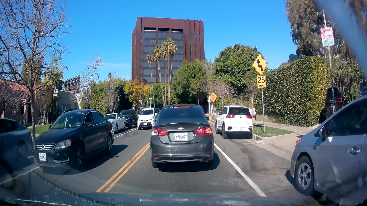 Woman Throws Drink On Car Behind Her