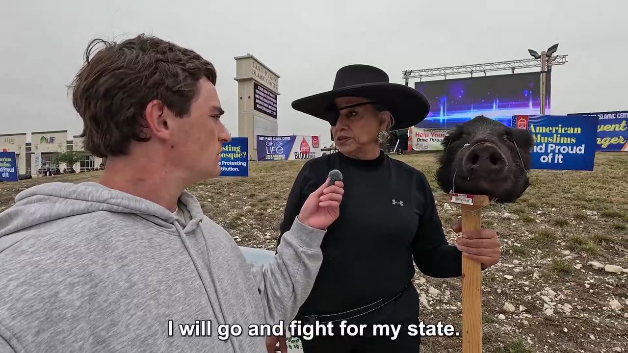 This lady in Texas had a boars head mounted on a stick at protest against the Islamification