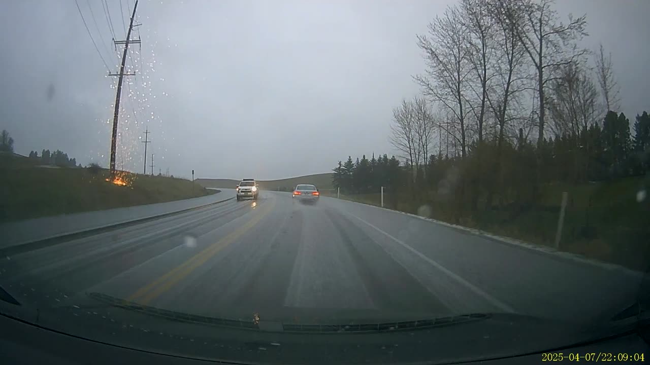 Dashcam Captures Lightning Striking Power Line